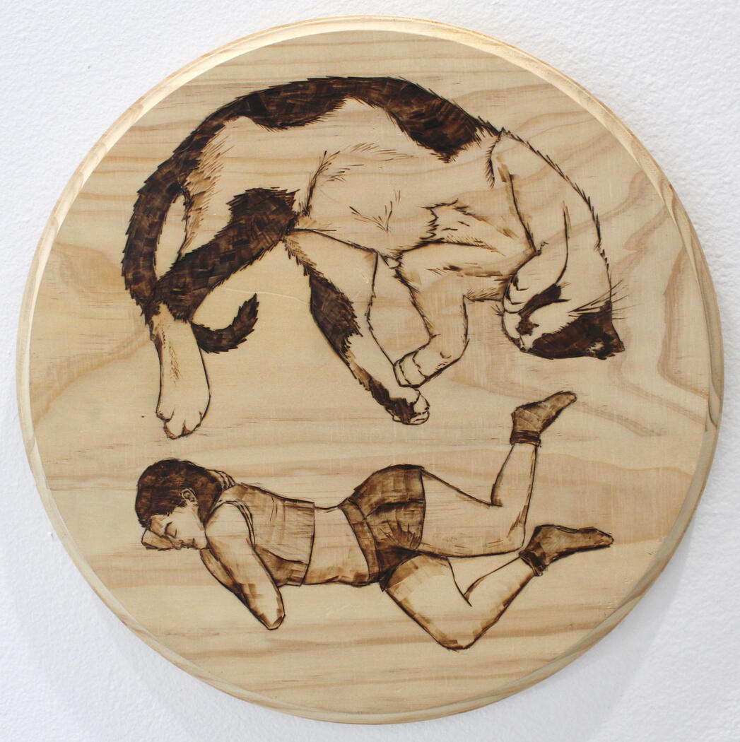 Two Sides; Pyrography on wood; 10” diameter, 2023